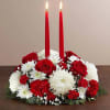Deck the halls with our festive Christmas centerpiece. This traditional arrangement is