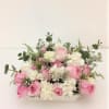 A sweet and awesome blossom consisting of fresh pink and white roses