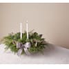 Holiday Centerpiece created with a variety of greens and accented with white
