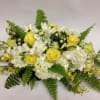 This casket spray comes complete with yellow roses, white hypericum, white hydrangea