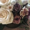 Gorgeous purples, whites and greens in this pretty arrangement for the style