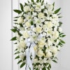 An elegant display of sweet serenity. White roses, Asiatic lilies, chrysanthemums and