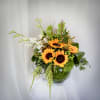 This is our beautiful sunflower arrangement with a lovely touch of orchids