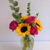 A sweet combination of fresh roses and sunflowers. Perfect for any living