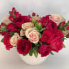 Bountiful arrangement in shades of pink florals garden roses and roses from