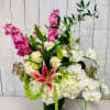 A beautiful arrangement of premium flowers such as hydrangeas, orchids, roses, stock