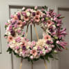 Funeral stand arrangement with pink flowers. Beautiful way of saying goodbye to
