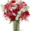 A cheerful and vibrant assortment of colorful flowers, this exquisite arrangement brims