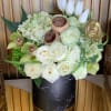 Designer Arrangement of roses, tulips, hydrangeas, orchids and decorative accessories in a