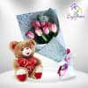 A hand tulips bouquet with Teddy bear.