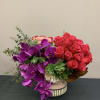Medium arrangement with hot pink roses, spray roses, phalaenopsis orchids, blush hydrangeas