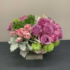 An arrangement with roses, tulips, succulents, and beautiful greenery. For a special
