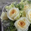 Designer&#039;s expert choice of seasonal bright white and creamy ivory blooms are