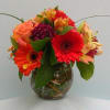Gerber daisies, alstroemeria and miscellaneous posies in a small curly willow bowl.
Perfect