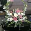 Centerpiece filled with Pink Lilies, White Orchids, White Roses