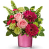 Pretty in pink! Soft pink roses and cheerful gerberas pop perfectly against