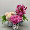 Three different arrangements in beautiful vases.