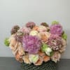 An elegant arrangement with a captivating mixture of beautiful flowers. 