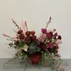 Bohemian style arrangement, with beautiful compliments of freshly chosen flowers.