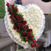 White stunning solid heart with bright red banner of roses outlined with