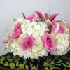 Precious pink roses and lilies mixed with white hydrangeas, will make a