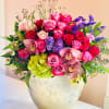 Beautiful arrangement consisting of an array of roses, hydrangeas, and cymbidium orchids