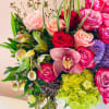 Beautiful arrangement consisting of an array of roses, hydrangeas, and cymbidium orchids