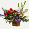 Pretty design including fresh flowers and butterfly in a basket.