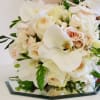 beautiful hand wrapped bouquet with garden roses and orchids.

Flowers and similar colors