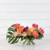 Tropical inspired vessel of flowers.  Filled with amazing blooms in a