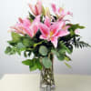 One of our most popular arrangements! Stargazer lilies are nestled in emerald