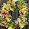 A Bright and Cheery seasonal wreath which comes in a variety of