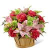 An natural woodchip basket holds a pretty bouquet of pink Asiatic lilies