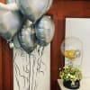 10 helium balloons and a balloon flower arrangement. 