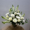 An elegant expression of caring, this beautiful bouquet of white roses and