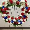 Standing tall, proud and patriotic, this dazzling free-standing wreath is made of