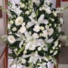 Elageant all white flower hanging spray with lilies, snapdragons, gerbra daisies and