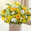  A vivid yellow and white bouquet of roses, snapdragons, alstroemeria, carnations