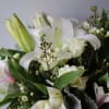 An elegant, timeless white mixed bouquet with Hydrangeas, Alstromelias, White Astiatic Lilies