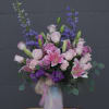 Lovely design including stargazer lilies, roses, fragrant stocks and accents in a