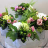 Send 3 or more. These lovely arrangements in white, green and pink