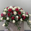Hot pink, white roses accented with baby&#039;s breath, and filling greens to