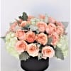 Two dz. peach roses in a floral hat box. Greens may very
