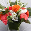 Dahlias, Roses, Lysianthus, and sweet peas in square glass vase.
