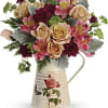 As timeless as mom&#039;s love, this beautiful bouquet of peach roses and
