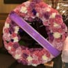 20inch round wreath filled with roses and carnations colors of choice 