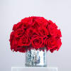 Premium red roses all around a unique vintage vase. 