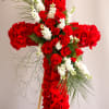 Red Roses in a cross shape with greens