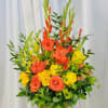 A beautiful modern display of orange and yellow flowers.  Flowers included
