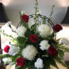 Mixture of Red and White Flowers in a Funeral Basket
Flowers include Larkspur